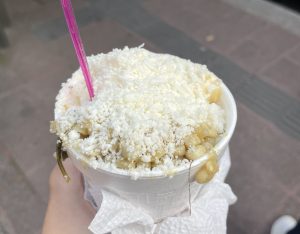 Esquite is corn kernels topped with butter, mayonnaise, garlic, cheese, lime and chili powder. This Veggie food option is found all over Mexico City.